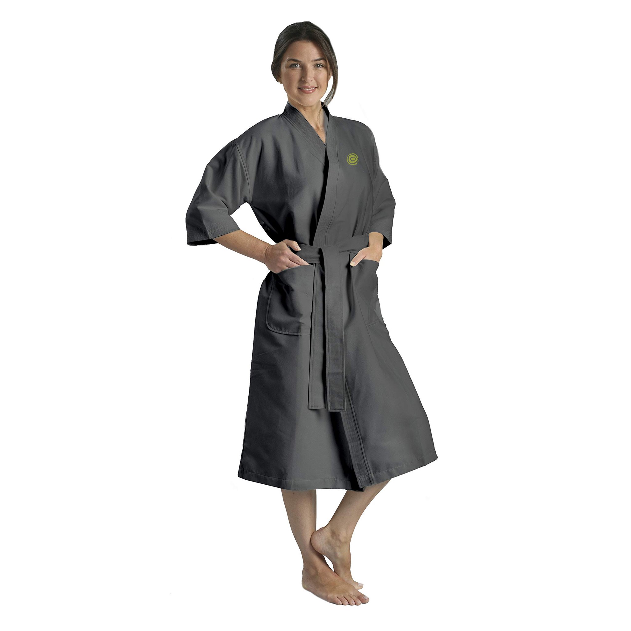 Woman in a grey bathrobe with pockets and her hands in the pockets