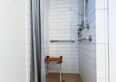 Inn at Ojo ADA room shower with grab bars and stool